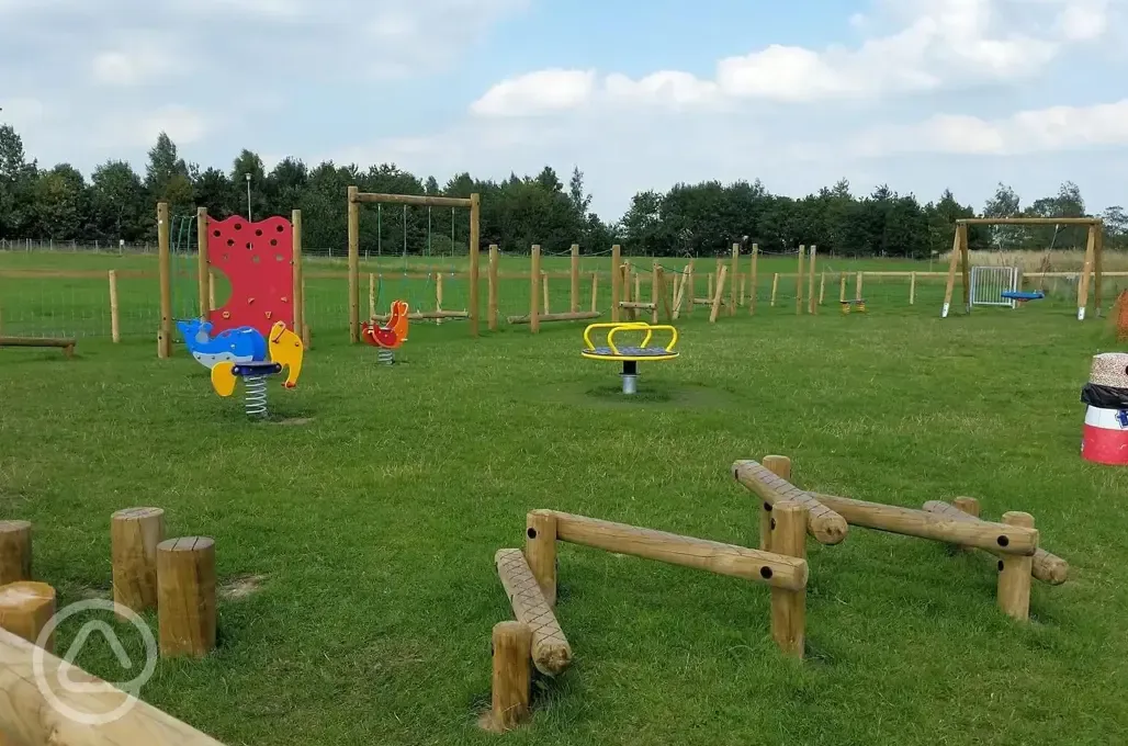 Children's playground in the orange area with assault course