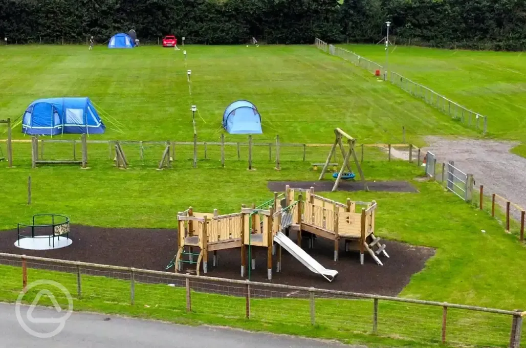 Children's play area next to the orange area and top field