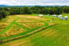 Aerial of the Purple area grass pitches and dog run field