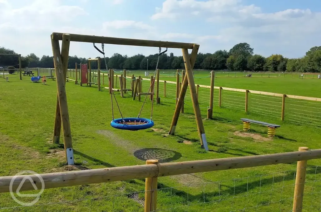 Children's playground in the orange area with swing
