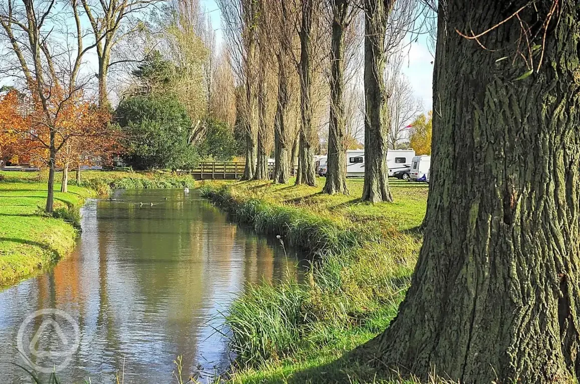 Grass pitches by the water