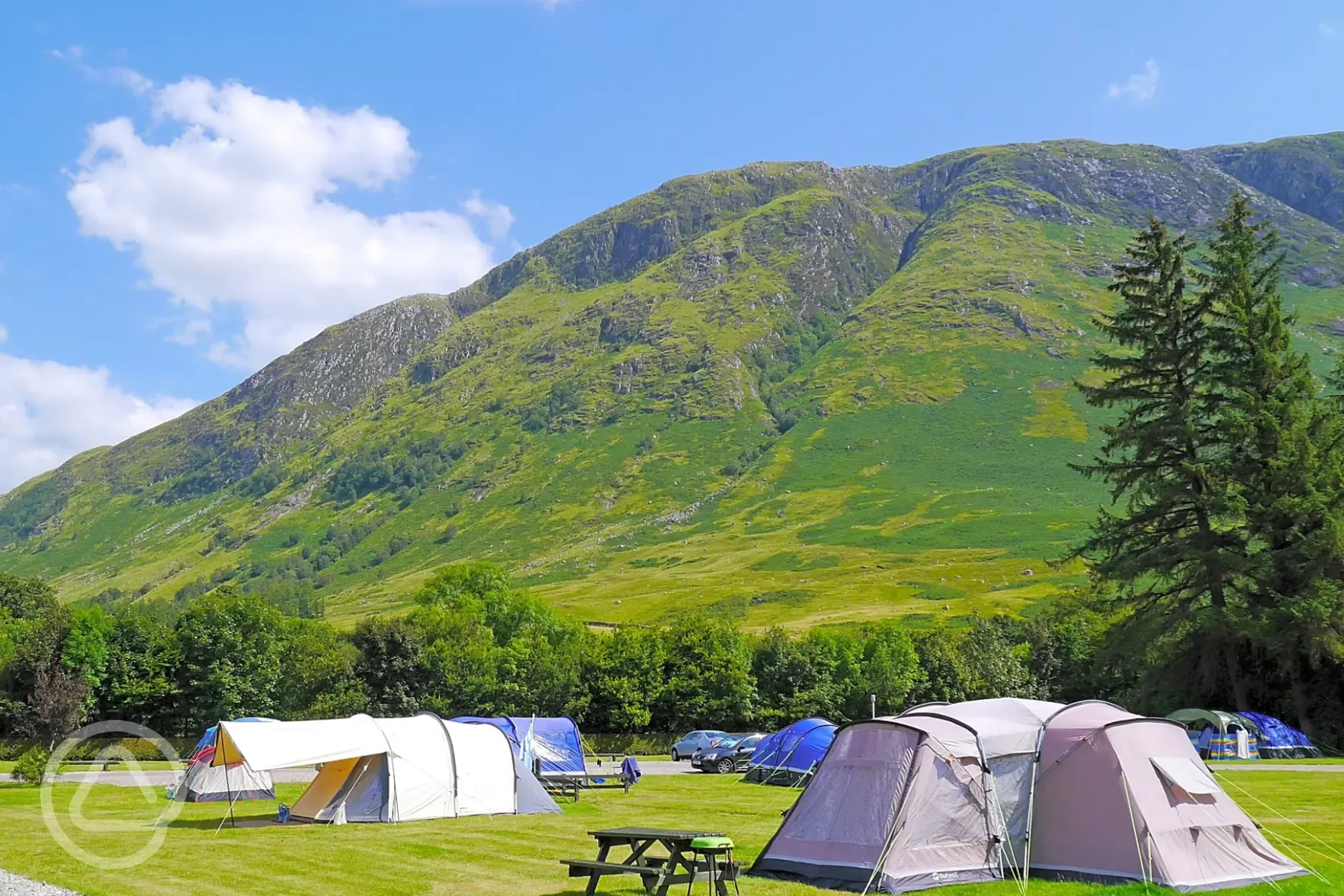 Electric grass pitches and mountain views at Glen Nevis Caravan and Camping Park