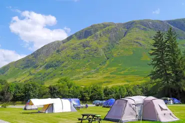Electric grass pitches and mountain views at Glen Nevis Caravan and Camping Park