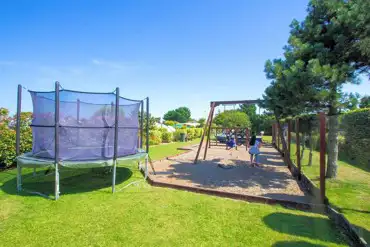 Play area with a trampoline