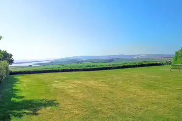 Grass tent pitches with sea views at Sea Barn Farm Camping Park