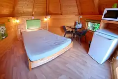 Camping pods with a double bed, fridge, microwave, kettle, TV/DVD player