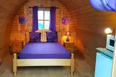 Camping pods with a double bed, fridge, microwave, kettle, TV/DVD player