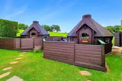 Double camping pods with enclosed decking areas