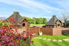 Double camping pods with enclosed decking areas