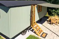 Shepherd's hut with outdoor seating and an electric hot tub