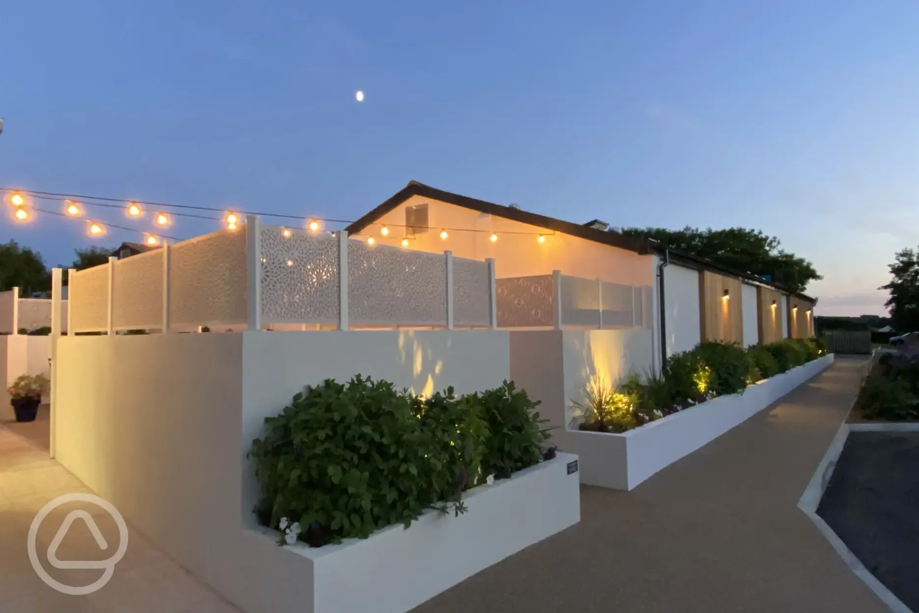 Campsite at dusk with fairy lights
