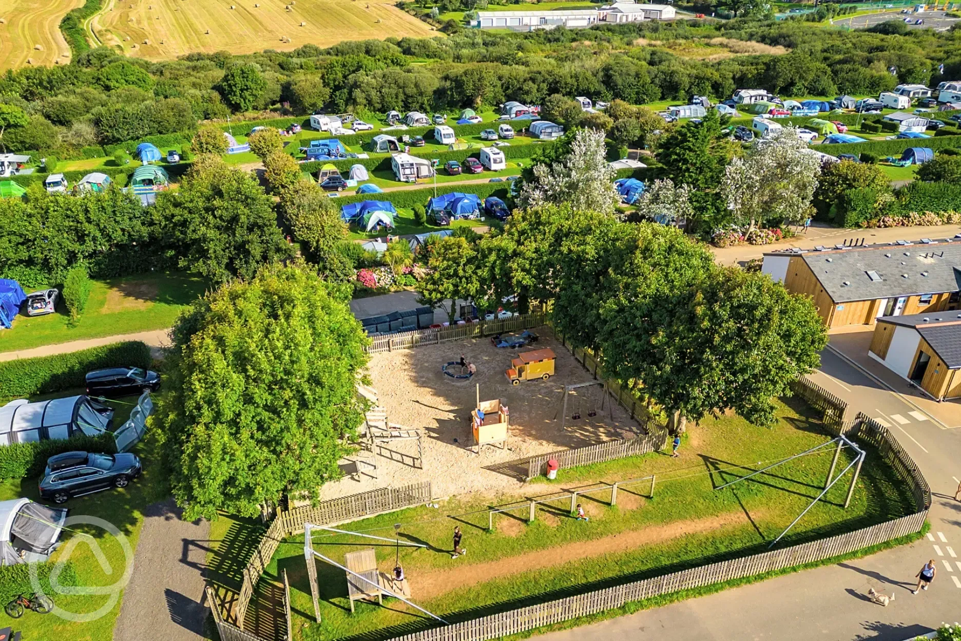 Aerial view of play area with a zip wire and sand pit