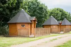 Camping cabins exterior with private decking (four persons) Camping cabins exterior with private decking (four persons)