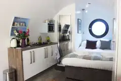 Ensuite glamping pod double bed and kitchenette