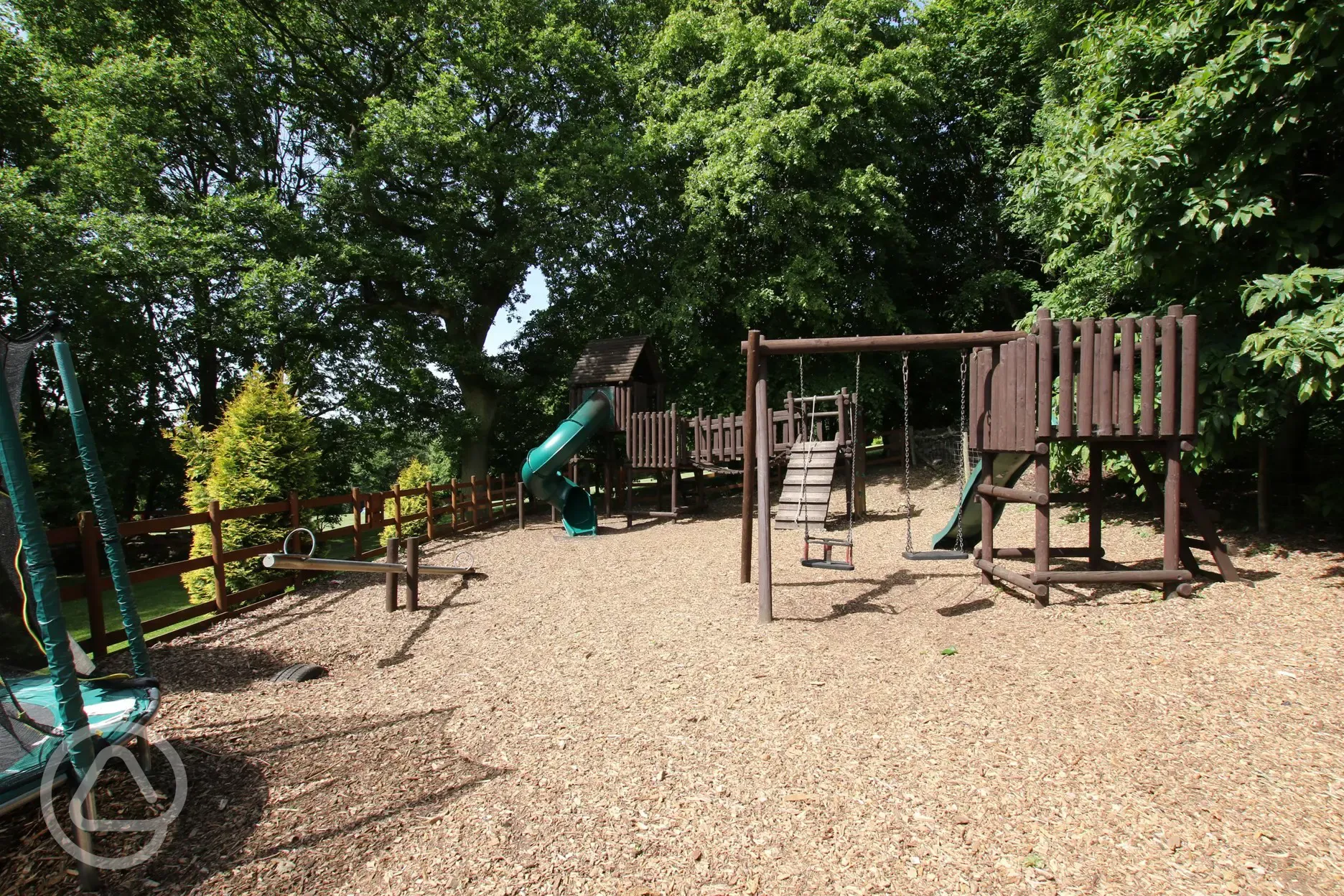 Play area with a climbing frame