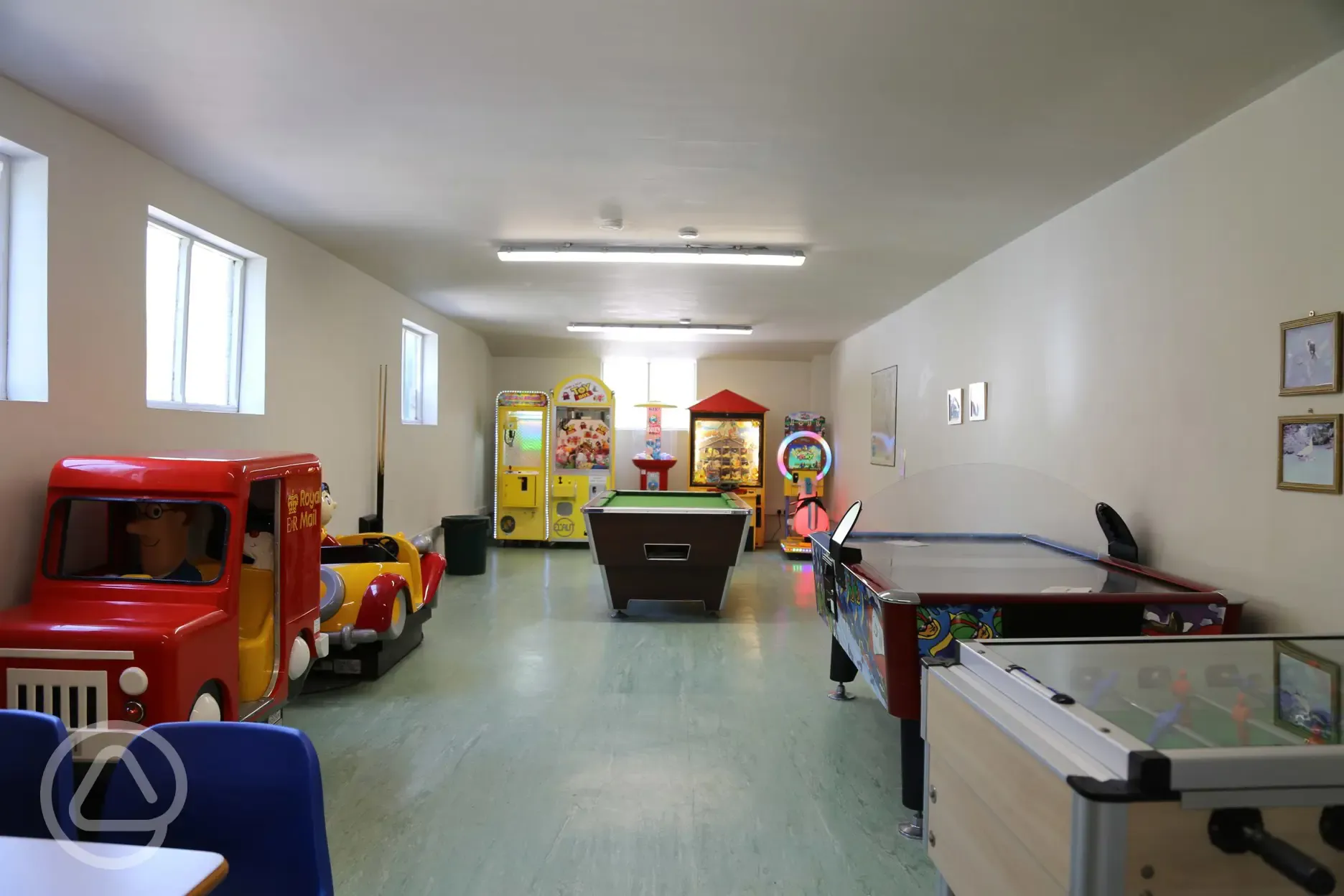 Games room with a pool table, a TV and arcade games