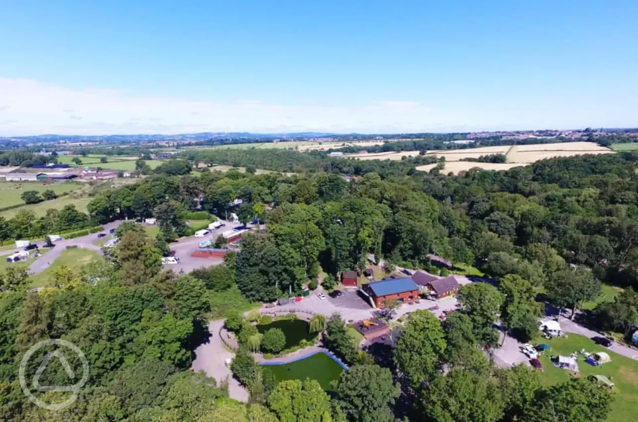 Aerial of Golden Valley Caravan Park showing the pond, park and facilities block