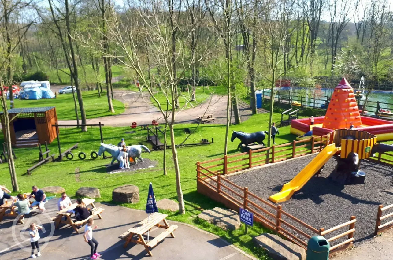 Children's play park with slide, inflatables and seating
