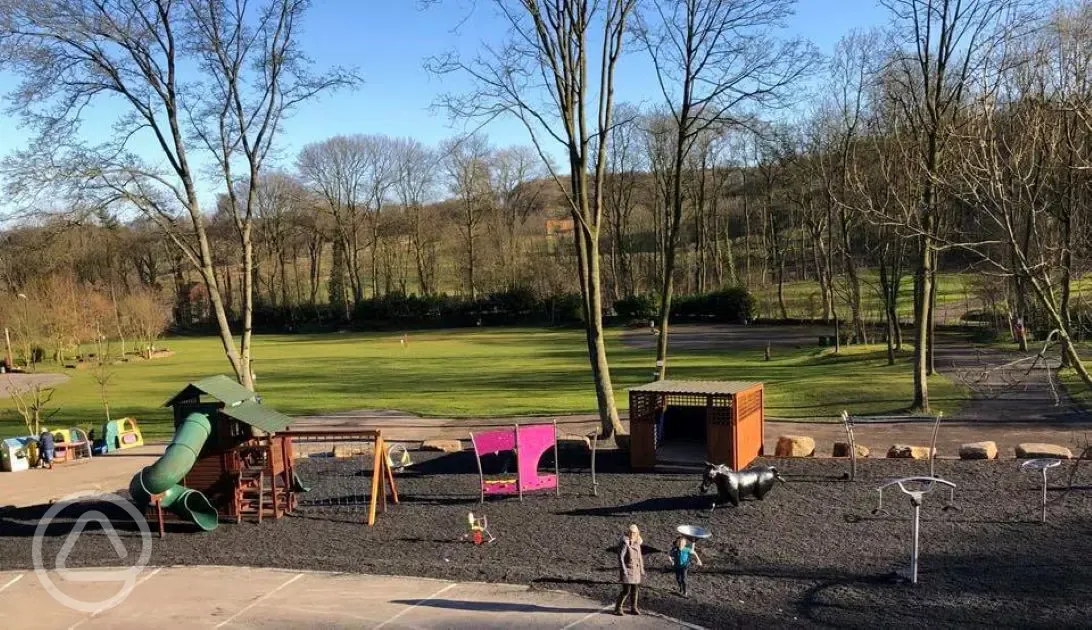 Children's play park with climbing area and a slide