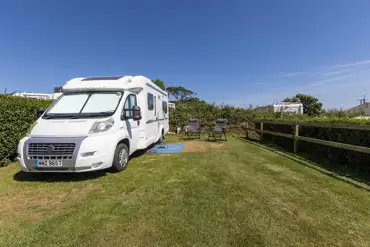 Electric grass pitch (10m x 10m) at Penhale Camping and Caravan Park