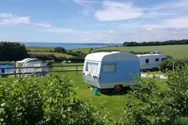 Electric grass pitches with distant sea views at Penhale Park