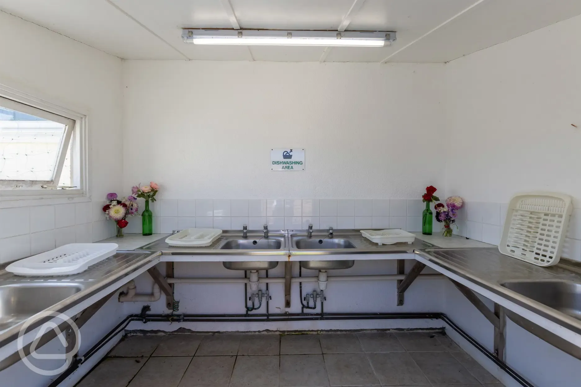 Indoor washing up area with drying racks