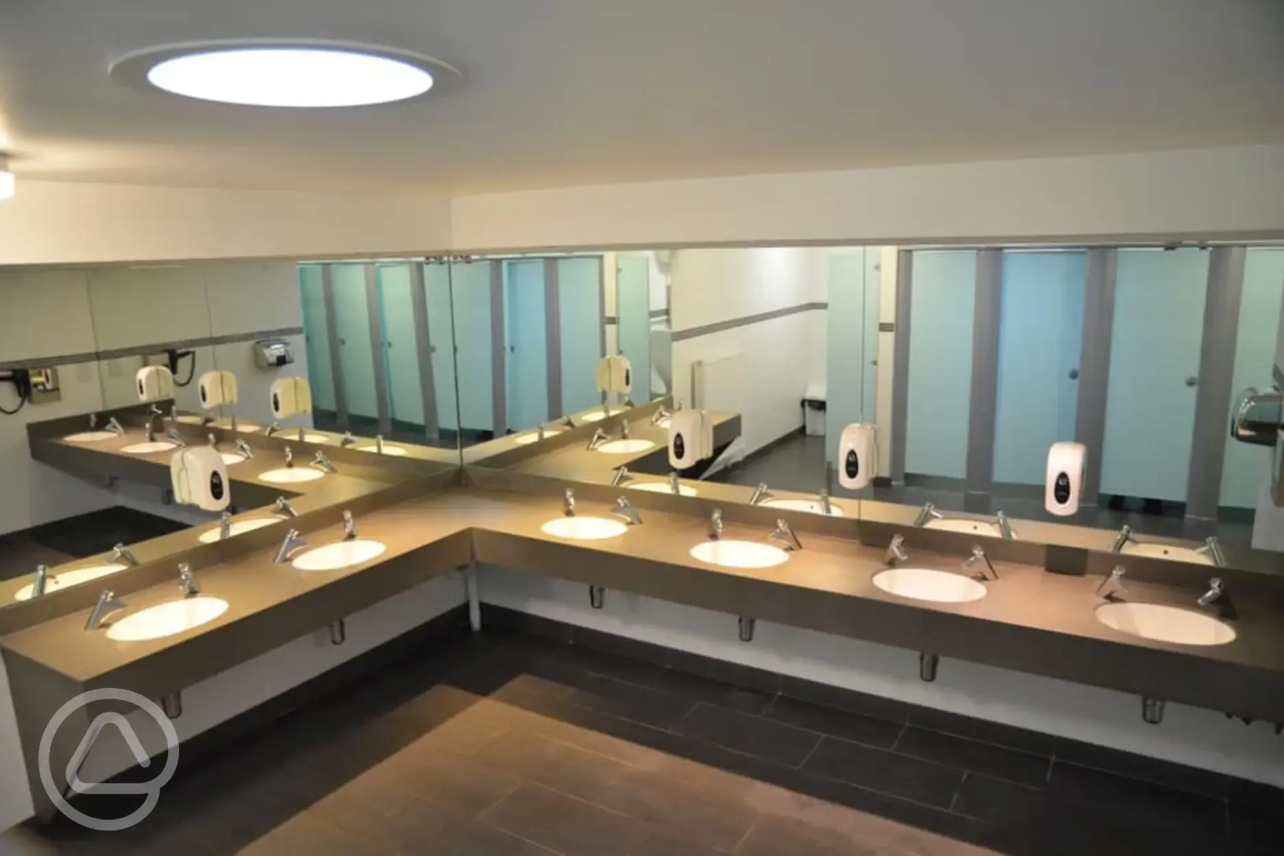 Toilet block with mirrors and sinks Toilet block with mirrors and sinks