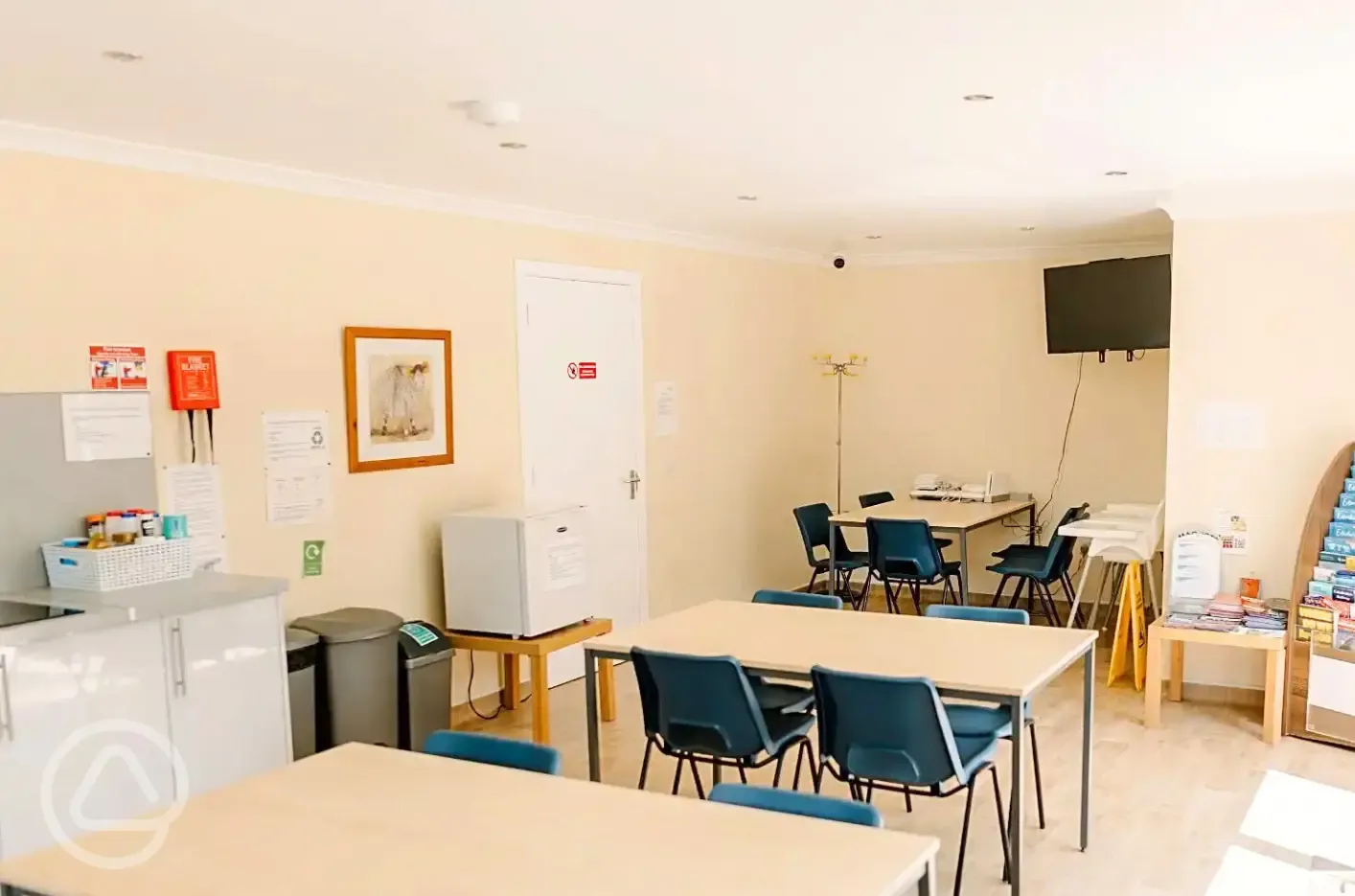 Communal kitchen seating, with tv and information area