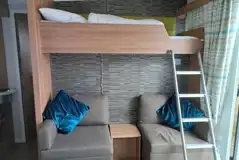 S pod (four person) interior with a double sofa bed and a bunk bed S pod (four person) interior with a double sofa bed and a bunk bed