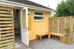 Cabin with a bench outdoor seating area