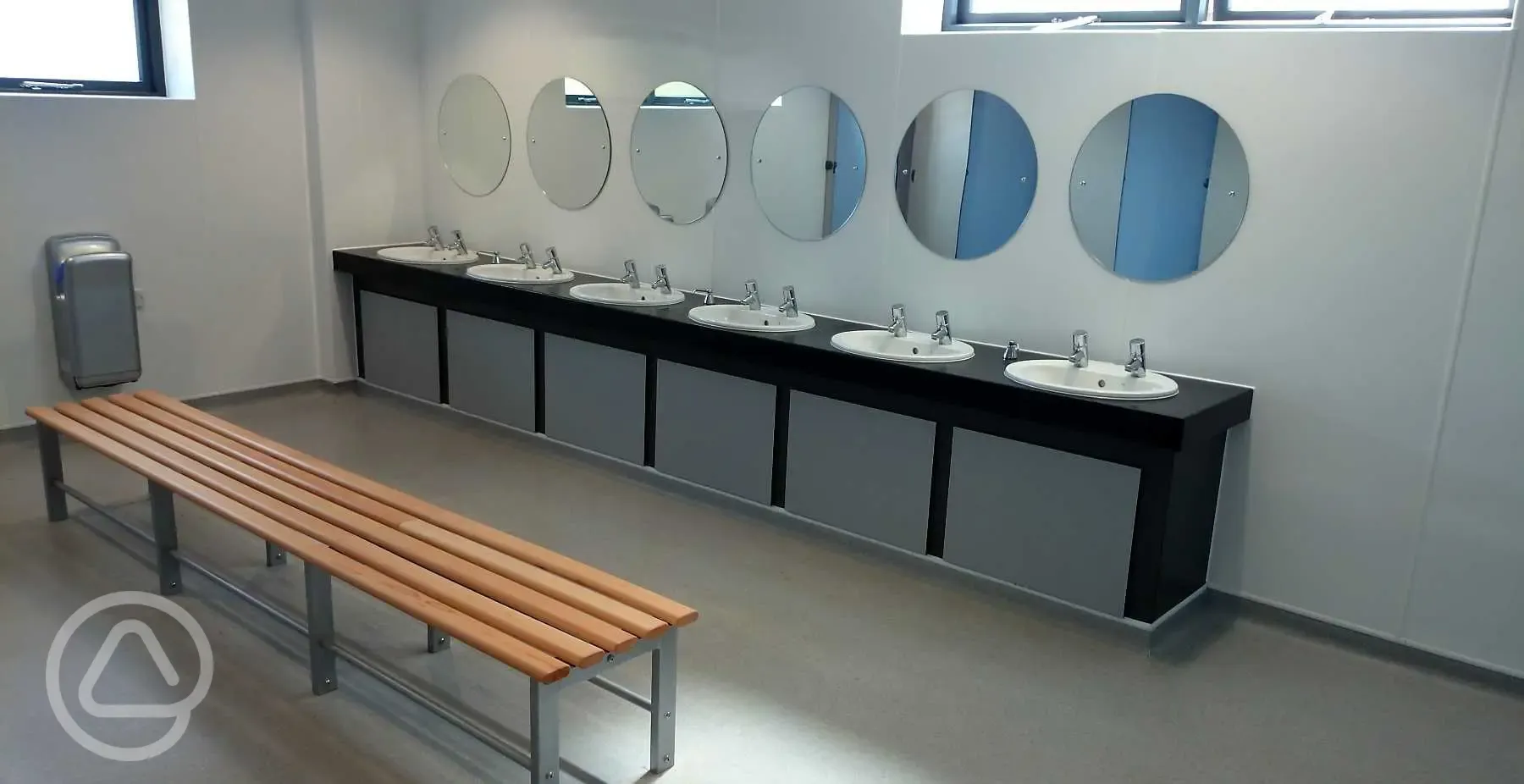 Sinks with mirrors and bench seating