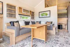 Jurassic Escape Pod lounge with a sofa, table, and soft furnishings