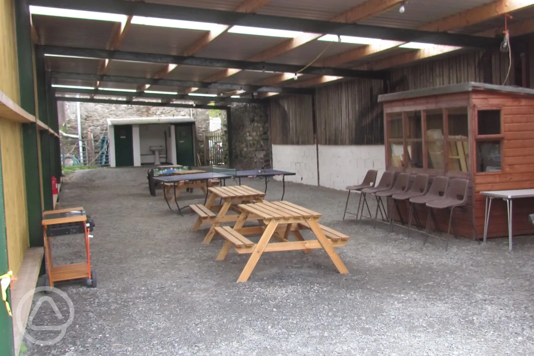 Undercover barn area including BBQ area, picnic tables etc.