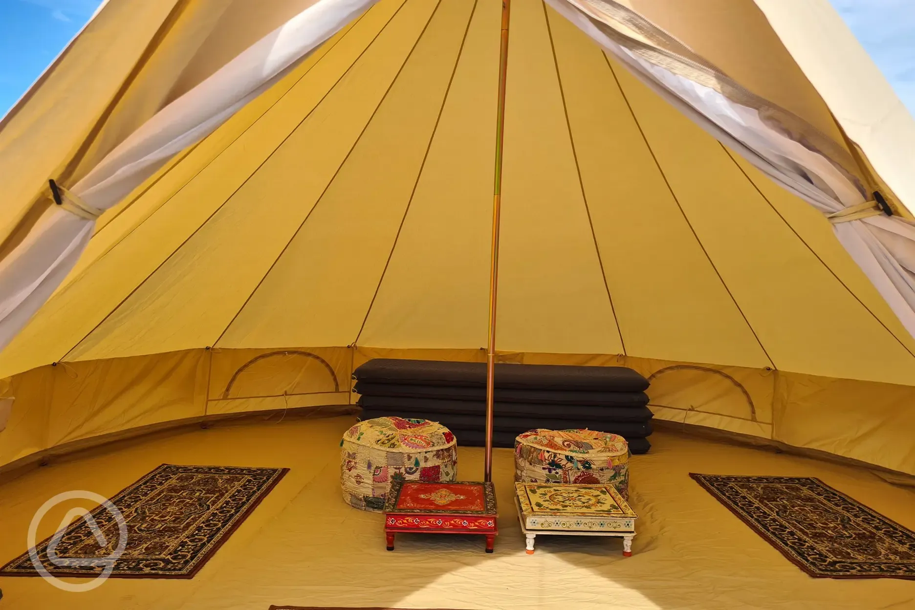  Primrose bell tent with five sleeping mats, a rug, and table