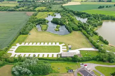Aerial of Allerthorpe Lakeland Park with grass and hardstanding pitches