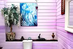 Toilets cubicles with a handwashing sink and mirror