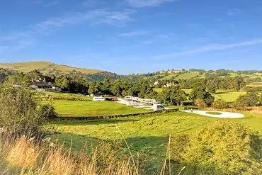 View of hardstanding and grass pitches at Bank House Farm
