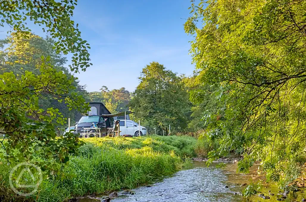 Electric hardstanding pitches by the river with 16 amp hook ups