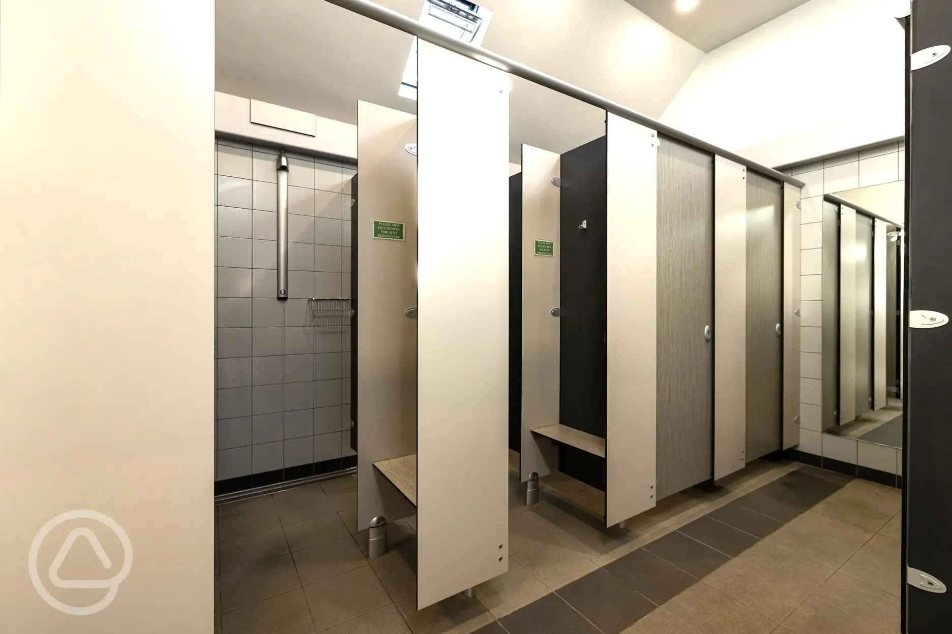 Showers with a changing area including hooks and mini benches