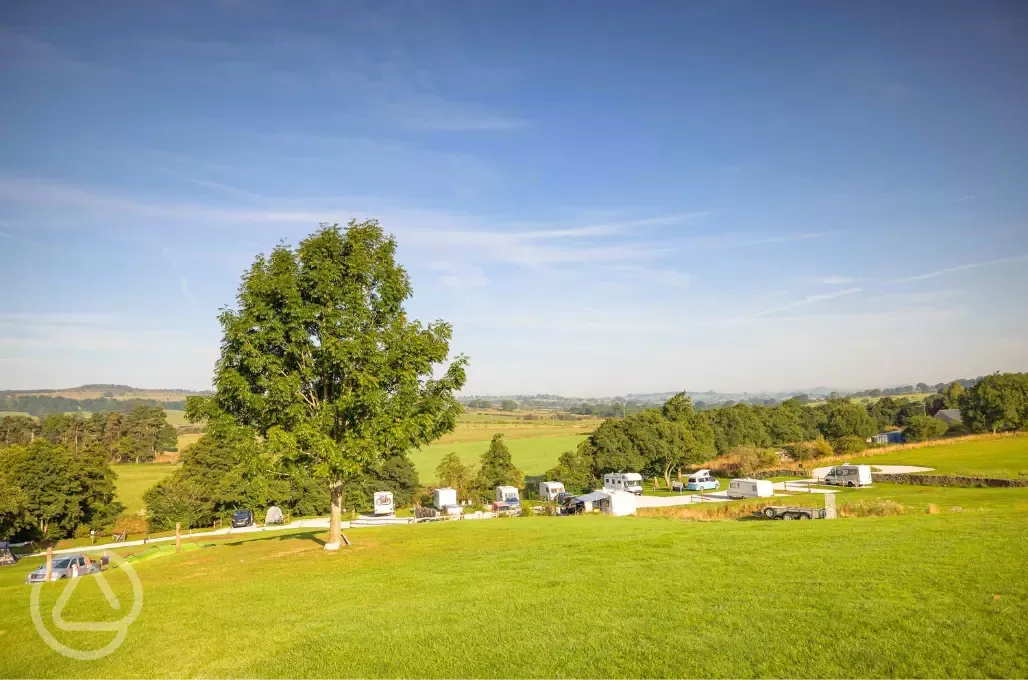 View over the hardstanding pitches and Peak District countryside
