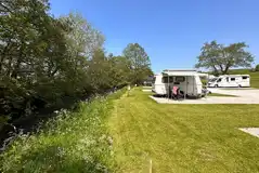 Riverside hardstanding pitches with awnings permitted