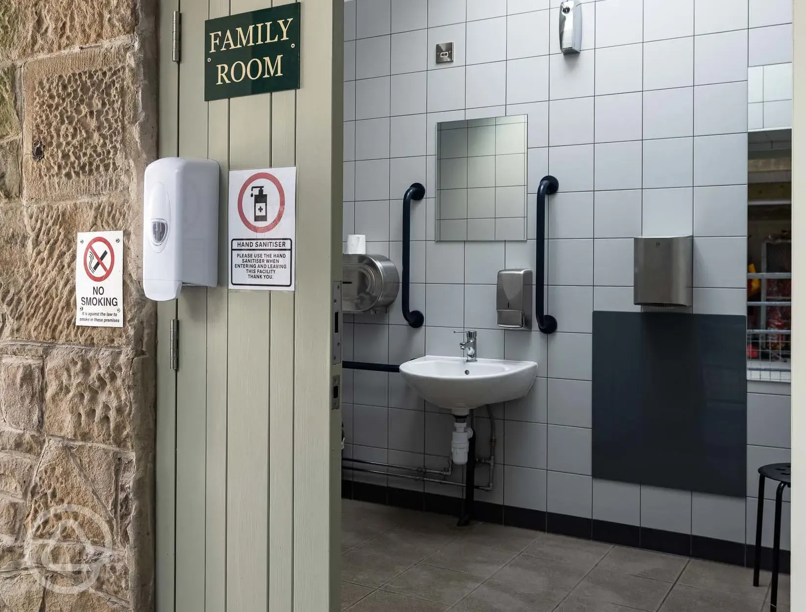 Accessible/family bathroom with grab rails and baby changing