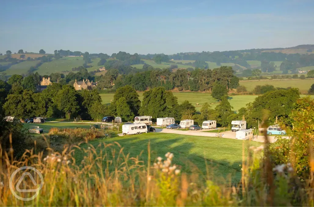 View over the hardstanding pitches and Peak District countryside