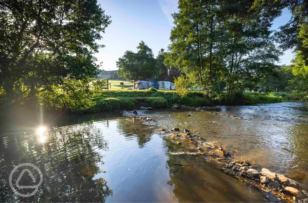 Hardstanding pitches with views of the River Manifold