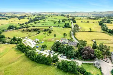 Aerial view of Bank House Farm and the surrounding Peak District countryside