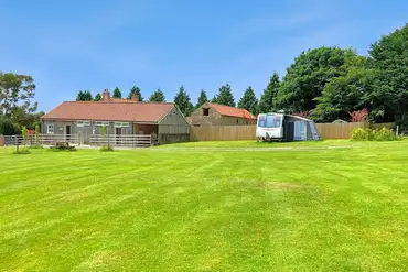 Grass 11m x 7m pitch located by the facilities block