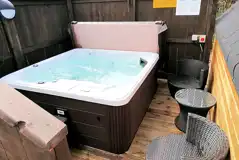 Private electric hot tub with privacy fencing