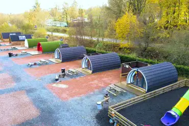 Aerial of Barrhill Holiday Park pods and play park
