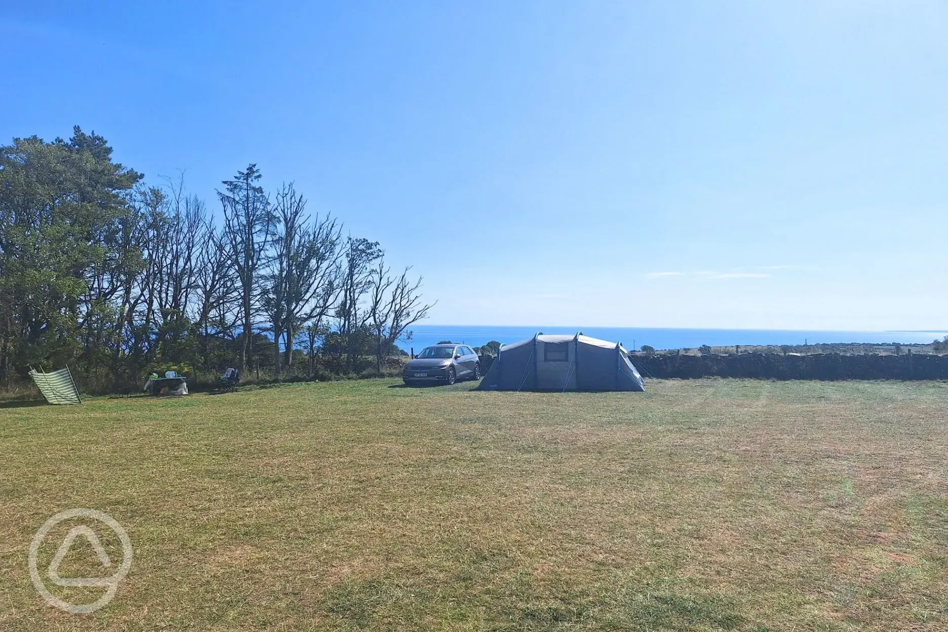 Grass tent pitches with sea views