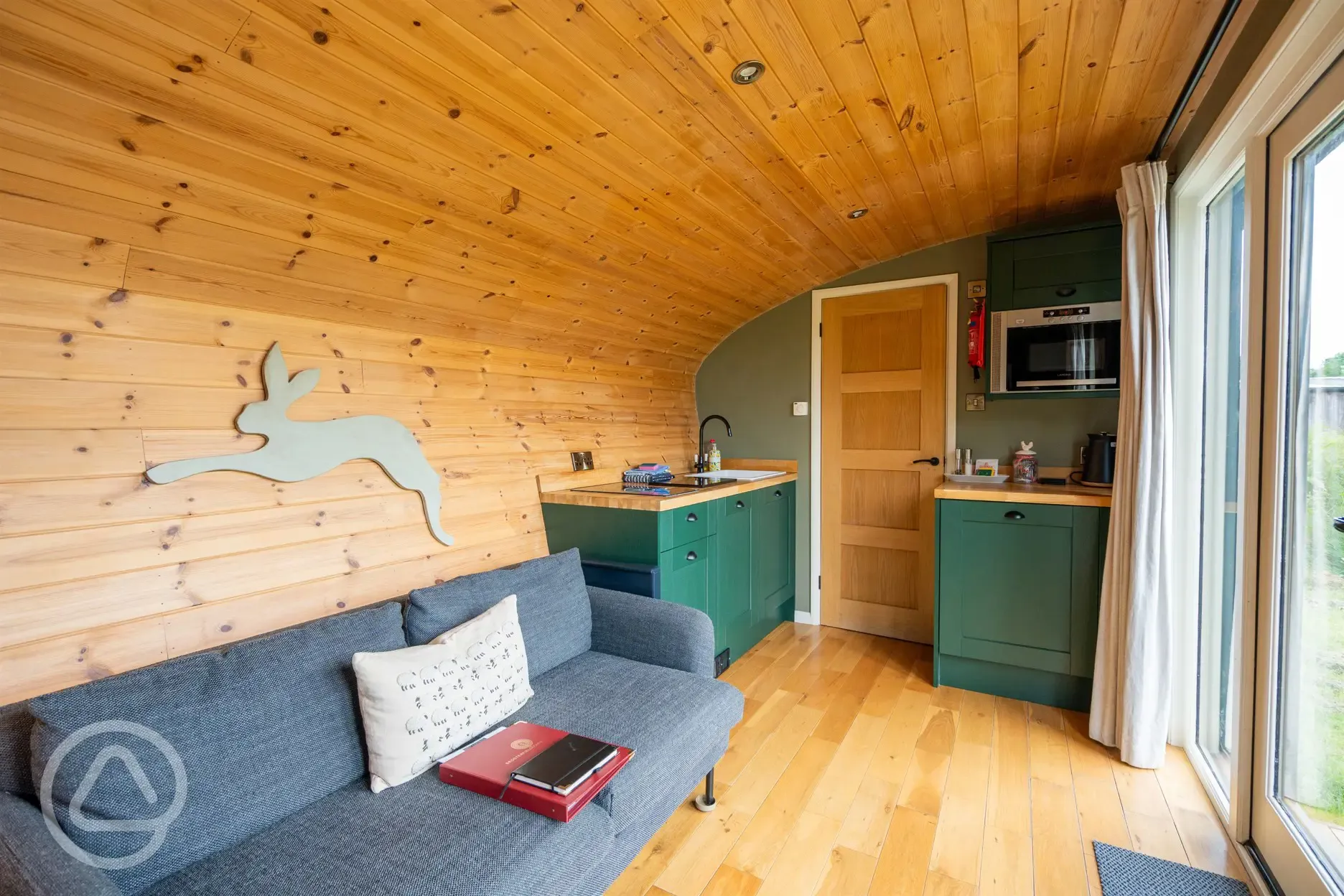 Hare's Retreat glamping cabin kitchen and living area